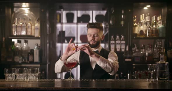 Bartender Is Squeezing Out Piece Orange Peel Decorating Cocktail