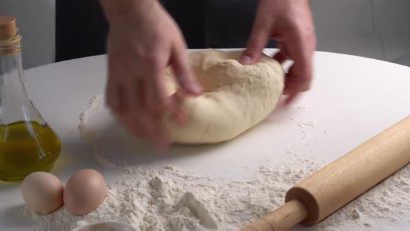 Male Hands Kneading Dough for Braed or Pastry