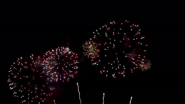 Many flashing colourful fireworks in event amazing with black background.