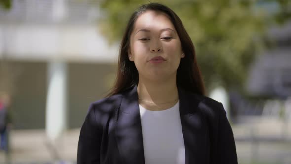 Happy Young Woman Talking at Camera