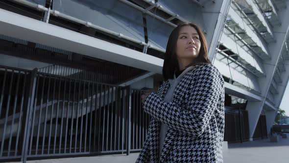 Confident Walk of a Young Asian Woman in the Downtown