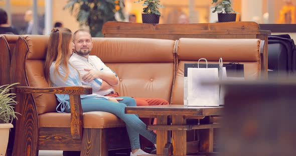 Couple Sitting in the Mall