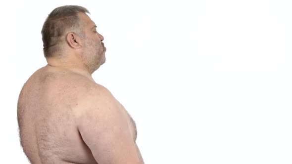 Obese Man Doing Exercise with Dumbbells
