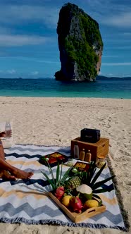 Koh Poda Krabi Thailand Asian Woman and European Men Having a Picnic on the Tropical Beach of Koh