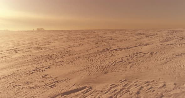 Aerial View of Cold Winter Landscape Arctic Field Trees Covered with Frost Snow Ice River and Sun