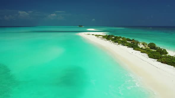 Aerial sky of perfect shore beach time by shallow ocean with white sandy background of a dayout near