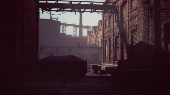 Abandoned Industrial Factory Buildings at Sunset alt