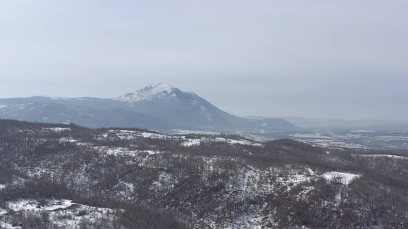Snow over the top of  mountain Rtanj 4K aerial video