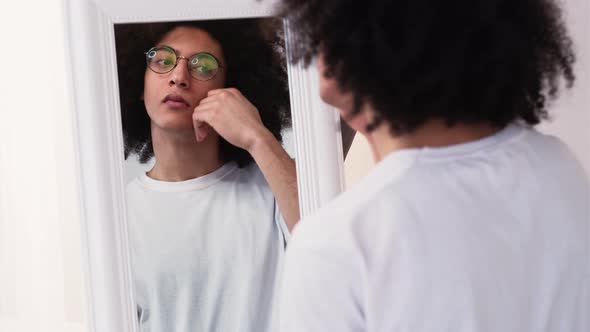 Man Grooming Skin Care Touching Face After Shaving