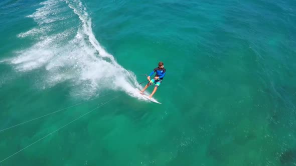 Aerial view of a man kitesurfing in Hawaii