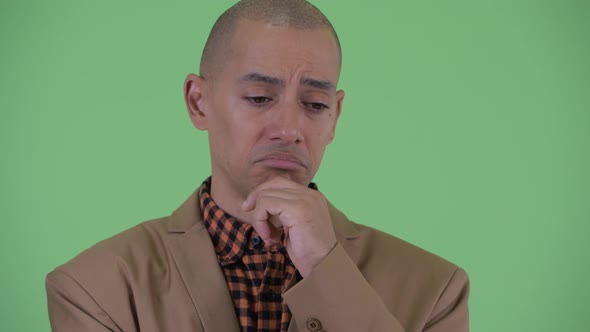 Sad Bald Multi Ethnic Businessman Thinking