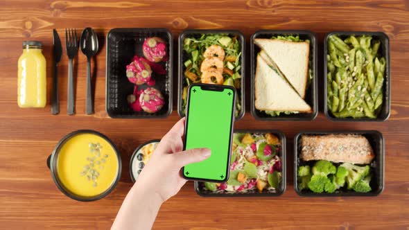 Food Delivery Top View Take Away Meals in Disposable Containers on Wooden Table