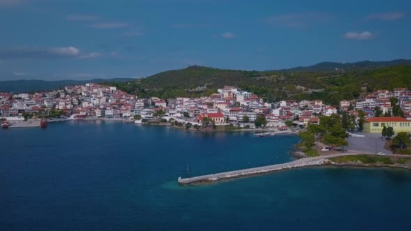 Drone view on seashore with embankment, marina and city beaches in Halkidiki, Greece