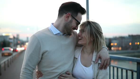 Romantic Couple in Love Hugging Kissing Outdoor in Sunset