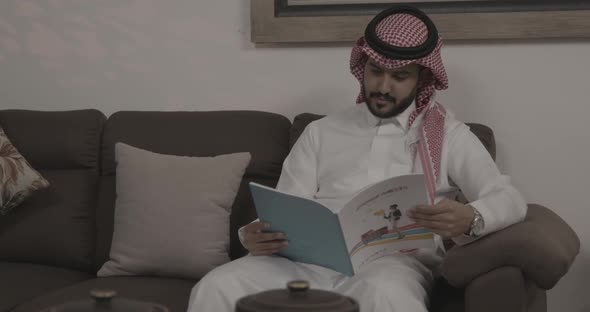 Saudi Man Reading Book