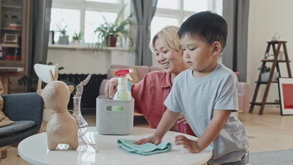 Asian Mom and Son Doing Housework Together