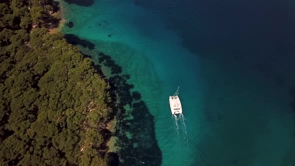 Aerial view of catamaran anchored near Mali Losinj island, Croatia.