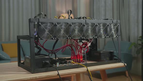 Close Up Of Cryptocurrency Mining Rig Is On The Table