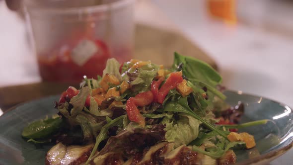 Restaurant Cooking  Chef Serves Salad with Fish on a Plate