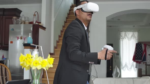 Side View of African American Man in Formal Suit Playing Video Game at Home in the Evening