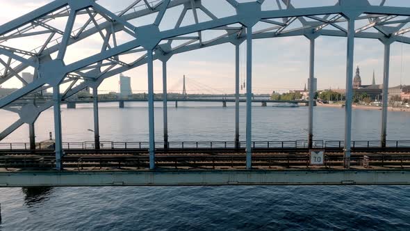 A Bridge Over River Daugava in Riga with a Train Passing By