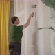 Woman Paint Wall in Her Room in Grey DIY Home Repair - VideoHive Item for Sale