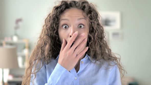 Amazed Curly Hair Woman Surprised by Positive Events