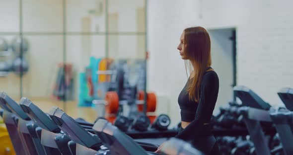 Girl Doing Cardio Exercises in the Gym