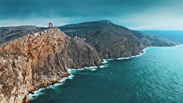 Aerial View of Ocean Waves Splashing in Rocks