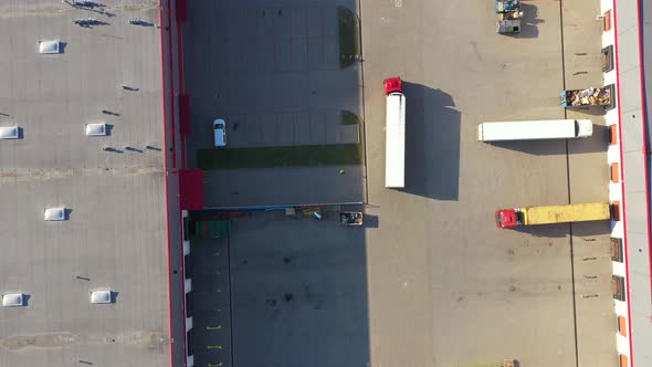 Aerial View of Cargo Containers and Distribution Warehouse