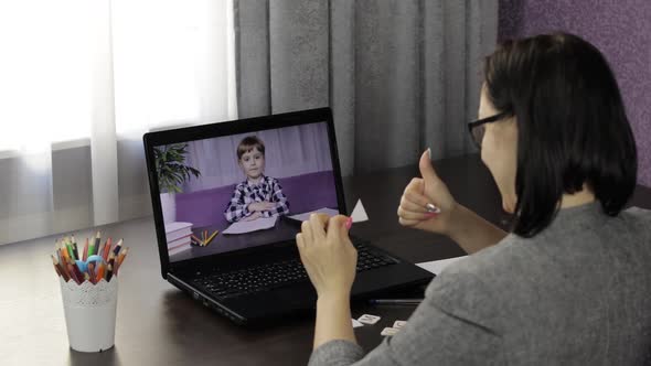 Woman Teacher Making Video Call on Laptop with Little Pupil. Distance Education