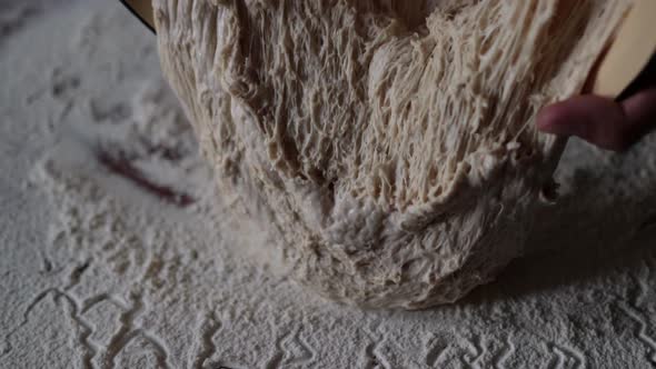 Knead The Dough Poured Into The Table With Flour