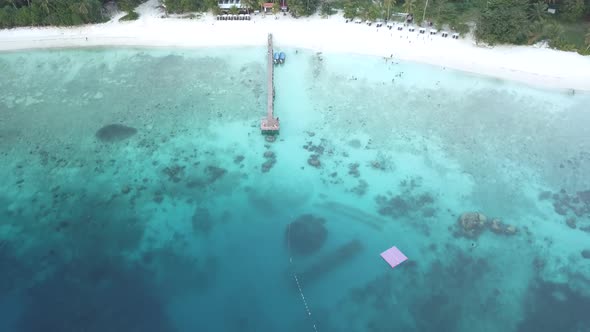 Drone footage from Malaysia island. Beach side tropical season fell.