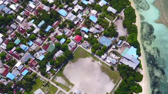 Aerial drone scenery of shore beach by lagoon with sand background