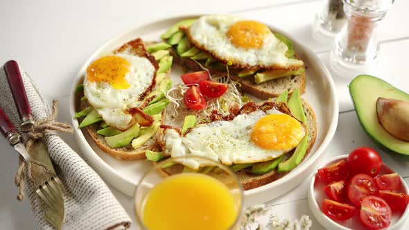 Delicious Healthy Breakfast with Sliced Avocado Sandwiches with Fried Egg