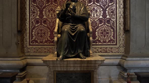 Bronze statue of Pope Saint Peter and Basilica, Vatican.