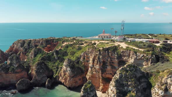 Ponta da Piedade Lighthouse over limestone headland in Lagos, Algarve, Portugal