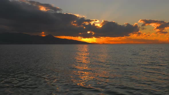 Sea Sunlight And Rainy Clouds 