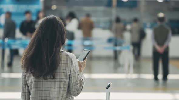 Girl Travelling for a Job Purpose Waiting for a Registration on Flight