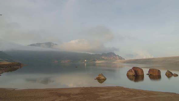 Time lapse Mengkuang dam with the sun light reflect on the stone 