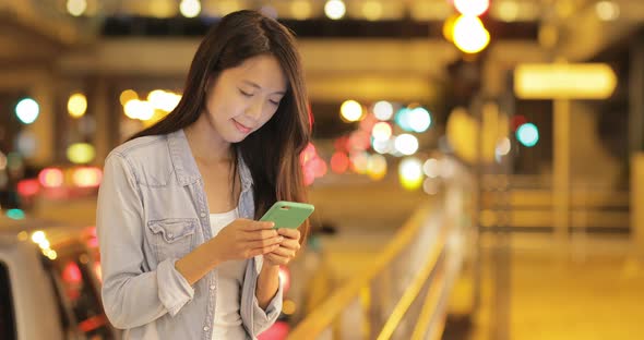 Woman use of cellphone at street