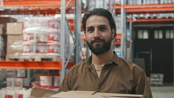 Guy Posing at Warehouse of Hardware Store