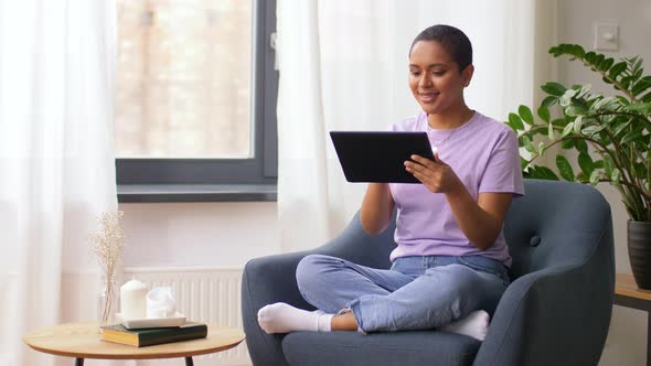 African American Woman with Tablet Pc at Home