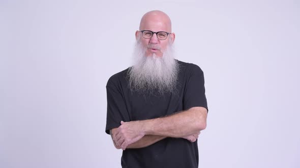 Happy Mature Bald Bearded Man Getting Good News