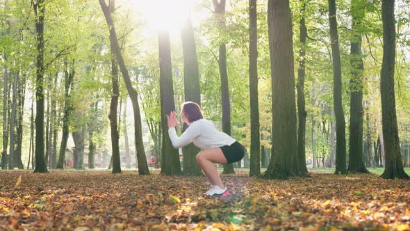 Woman Doing Sport Exercises on Fresh Air