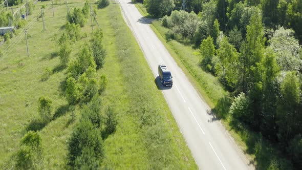 A Blue Van in Asphalt Road