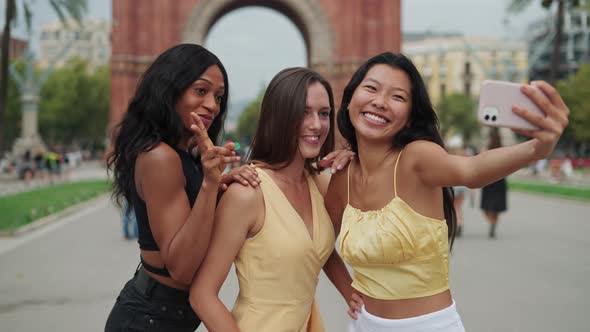 Three Travelling Women of Different Races Taking Selfie During Sightseeing