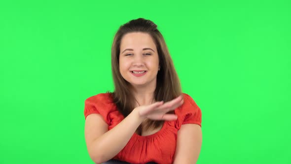 Portrait of Cute Girl Is Smiling and Dancing Funny. Green Screen