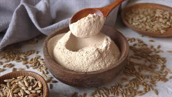 Raw rye flour in a bowl close up