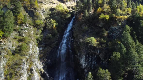 Close up Drone aerial view of a waterfall in Lüsens Valley in october, located in Austria